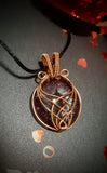 COPPER CAGED DRAGON EYE PENDANT